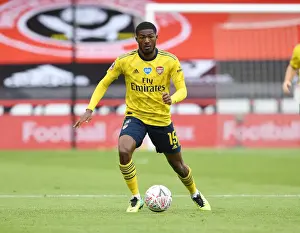 Arsenal's Ainsley Maitland-Niles in Action: FA Cup Quarterfinal Showdown vs Sheffield United