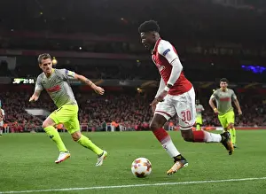 Arsenal's Ainsley Maitland-Niles Clashes with Simon Zoller of FC Köln in Europa League Action