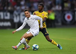 Angers SCO V Arsenal 2019-20 Prints: Arsenal's Ainsley Maitland-Niles Closes Down Angers Rachid Alioui in Pre-Season Friendly