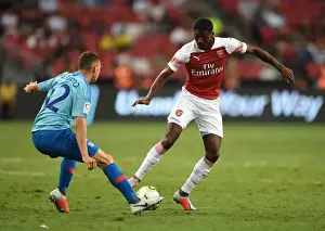 Arsenal V Atletico Madrid 2018-19 Prints: Arsenal's Ainsley Maitland-Niles Faces Off Against Atletico Madrid's Mikel Carro in International Champions Cup