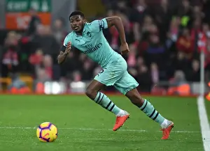 Liverpool V Arsenal 2018-19 Prints: Arsenal's Ainsley Maitland-Niles Faces Off Against Liverpool at Anfield