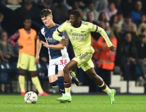 Arsenal's Ainsley Maitland-Niles Faces Off Against West Bromwich Albion's Toby King in Carabao Cup Clash