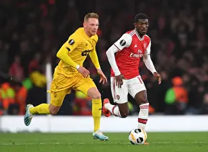 Arsenal's Ainsley Maitland-Niles Goes Head-to-Head with Renaud Emond in Europa League Showdown