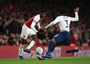 Arsenal V Tottenham Hotspur Carabao Cup 2018-19 Prints: Arsenal's Ainsley Maitland-Niles Outmaneuvers Tottenham's Danny Rose in Carabao Cup Quarterfinal Showdown