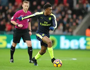 Swansea City V Arsenal - 2016-17 Prints: Arsenal's Alex Iwobi in Action against Swansea City (Premier League 2016-17)