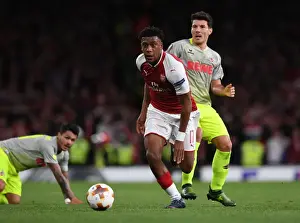 Arsenal V FC Köln 2017-18 Prints: Arsenal's Alex Iwobi Clashes with FC Köln's Leonardo Bittencourt and Milos Jojic in Europa League Battle