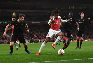 Arsenal V Stade Rennais 2018-19 Prints: Arsenal's Alex Iwobi Clashes with Hamari Traore and Damien Da Silva of Stade Rennais in Europa League Showdown
