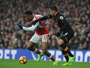Images Dated 11th February 2017: Arsenal's Alex Iwobi Clashes with Hull's Omar Elabdellaoui in Premier League Showdown