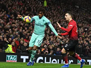 Manchester United V Arsenal 2018-19 Prints: Arsenal's Alex Iwobi Clashes with Manchester United's Matteo Darmian in Premier League Showdown