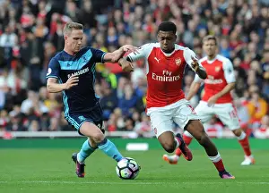 Arsenal's Alex Iwobi Clashes with Middlesbrough's Adam Forshaw in Premier League Showdown