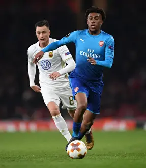 Arsenal V Östersunds FK 2017-18 Prints: Arsenal's Alex Iwobi Clashes with Östersunds Jamie Hopcutt in Europa League Showdown