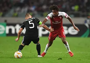 Qarabag V Arsenal 2018-19 Prints: Arsenal's Alex Iwobi Clashes with Qarabag's Maksim Medvedev in Europa League Match