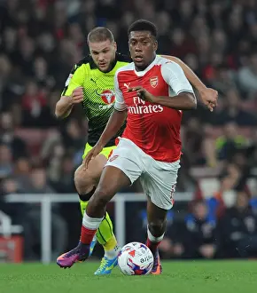 Arsenal V Reading EFL Cup 2016-17 Prints: Arsenal's Alex Iwobi Clashes with Reading's Joey van den Berg in EFL Cup Showdown