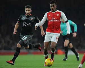 Arsenal V Southampton EFL Cup 2016-17 Prints: Arsenal's Alex Iwobi Clashes with Southampton's Sam McQueen in EFL Cup Quarter-Final