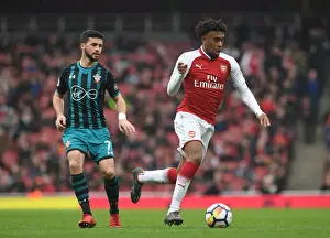 Arsenal V Southampton 2017-18 Prints: Arsenal's Alex Iwobi Clashes with Southampton's Shane Long in Premier League Showdown