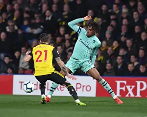 Arsenal's Alex Iwobi Clashes with Watford's Kiko Femenia in Premier League Showdown