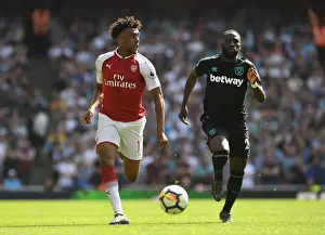 Arsenal's Alex Iwobi Clashes with West Ham's Arthur Masuaku in Premier League Showdown