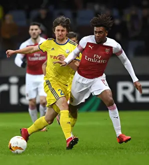BATE Borisov V Arsenal 2018-19 Prints: Arsenal's Alex Iwobi Faces Off Against BATE Borisov's Dmitri Baga in UEFA Europa League Clash