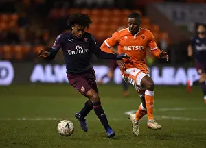 Arsenal's Alex Iwobi Faces Off Against Blackpool's Donervon Daniels in FA Cup Clash