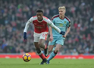 Arsenal V Burnley 2016-17 Prints: Arsenal's Alex Iwobi Faces Off Against Burnley's Ben Mee in Premier League Clash