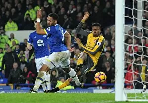 Images Dated 13th December 2016: Arsenal's Alex Iwobi Faces Off Against Everton's Ashley Williams in Intense Premier League Showdown