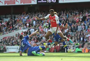 Arsenal's Alex Iwobi Faces Off Against Everton's Morgan Schneiderlin and Mason Holgate