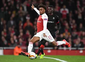 Arsenal V Stade Rennais 2018-19 Prints: Arsenal's Alex Iwobi Faces Off Against Ismaila Sarr in Intense Europa League Clash