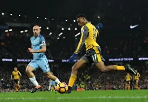 Manchester City V Arsenal 2016-17 Prints: Arsenal's Alex Iwobi Faces Off Against Manchester City's Pablo Zabaleta in Premier League Showdown