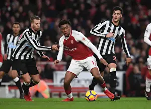 Arsenal V Newcastle United 2017-18 Prints: Arsenal's Alex Iwobi Faces Off Against Newcastle's Mikel Merino and Florian Lejeune