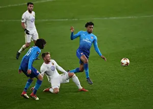 Arsenal V Östersunds FK 2017-18 Prints: Arsenal's Alex Iwobi Faces Off Against Östersunds Dennis Widgren in Europa League Clash