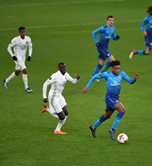 Arsenal V Östersunds FK 2017-18 Prints: Arsenal's Alex Iwobi Faces Off Against Östersunds Ken Sema in Europa League Clash