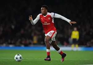 Arsenal V Paris Saint-Germain 2016-17 Prints: Arsenal's Alex Iwobi Faces Off Against Paris Saint-Germain in the 2016-17 Champions League
