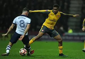 Preston North End V Arsenal - FA Cup - 2017 Prints: Arsenal's Alex Iwobi Faces Off Against Preston's Alan Browne in FA Cup Clash