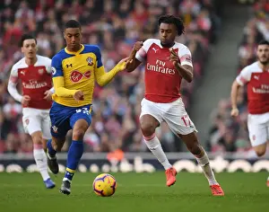 Arsenal's Alex Iwobi Faces Off Against Southampton's Yan Valery in Premier League Clash