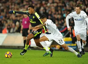Swansea City V Arsenal - 2016-17 Prints: Arsenal's Alex Iwobi Faces Off Against Swansea's Kyle Naughton in Premier League Clash