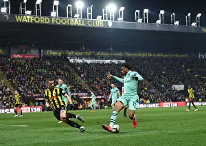 Arsenal's Alex Iwobi Faces Off Against Watford's Daryl Janmaat in Premier League Clash