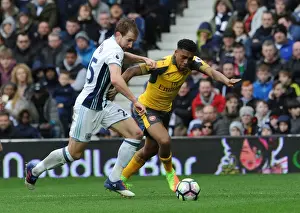 West Bromwich Albion V Arsenal 2016-17 Prints: Arsenal's Alex Iwobi Faces Off Against West Bromwich Albion's Craig Dawson in Intense Premier League Clash