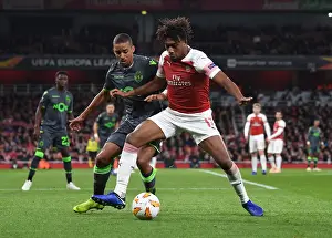 Arsenal V Sporting Clube De Portugal 2018-19 Prints: Arsenal's Alex Iwobi Fends Off Sporting's Bruno Gasper in Europa League Clash