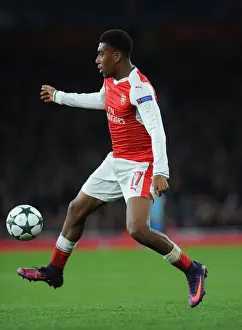 Arsenal V Paris Saint-Germain 2016-17 Prints: Arsenal's Alex Iwobi Goes Head-to-Head with Paris Saint-Germain in the 2016-17 UEFA Champions League