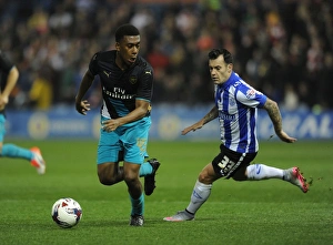 Sheffield Wednesday V Arsenal - Capital One Cup 2015-16 Prints: Arsenal's Alex Iwobi Goes Head-to-Head with Ross Wallace in Capital One Cup Showdown