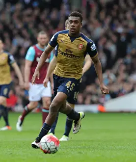 West Ham United V Arsenal 2015-16 Prints: Arsenal's Alex Iwobi Goes Head-to-Head with West Ham in Intense Premier League Showdown (2015-16)