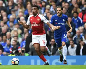 Chelsea V Arsenal 2017-18 Prints: Arsenal's Alex Iwobi Outmaneuvers Chelsea's Cesc Fabregas in Premier League Clash