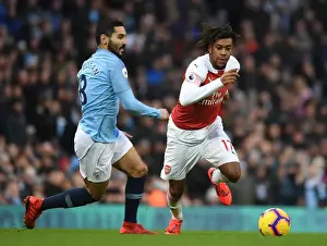Manchester City V Arsenal 2018-19 Prints: Arsenal's Alex Iwobi Outmaneuvers Manchester City's Ilkay Gundogan in Premier League Clash