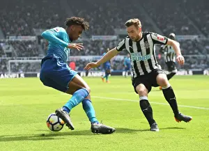 Newcastle United V Arsenal 2017-18 Prints: Arsenal's Alex Iwobi Outmaneuvers Newcastle's Paul Dummett in Intense Premier League Clash
