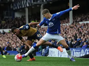 Everton V Arsenal 2015-16 Prints: Arsenal's Alex Iwobi vs Everton's John Stones: Intense Face-Off in Premier League Showdown