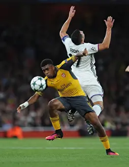 Arsenal V FC Basel 2016-17 Prints: Arsenal's Alex Iwobi vs. FC Basel's Marek Suchy: A Champions League Showdown