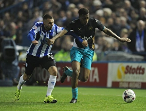 Sheffield Wednesday V Arsenal - Capital One Cup 2015-16 Prints: Arsenal's Alex Iwobi vs Jack Hunt in Capital One Cup Showdown