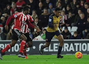 Images Dated 26th December 2015: Arsenal's Alex Iwobi vs. Southampton's Cuco Martina: Intense Clash in Premier League Match