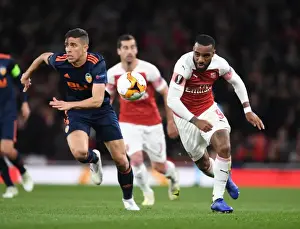 Arsenal's Alex Lacazette Battles Past Valencia's Gabriel in UEFA Europa League Semi-Final Showdown
