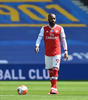 Brighton And Hove Albion V Arsenal 2019-20 Prints: Arsenal's Alex Lacazette at Empty Brighton & Hove Albion Stadium during 2019-2020 Premier League Match